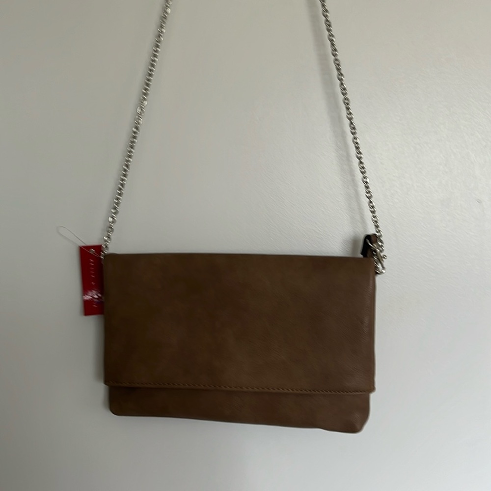 Kelly and Katie clutch. Leather like material. NWT